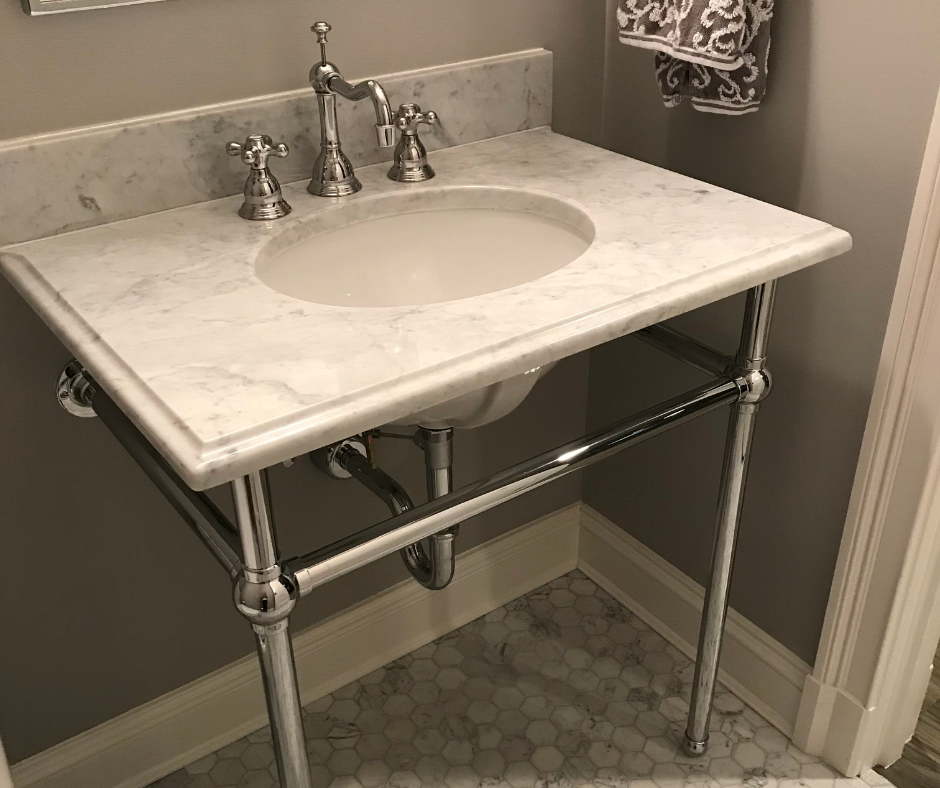 Free standing vanity with marble top, under mount sink on chrome base